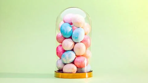 Easter eggs in glass dome Stock Photos