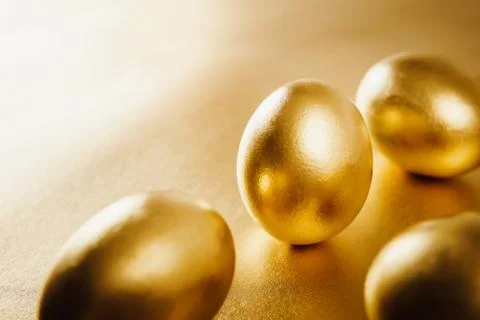 Easter eggs on a gold background Stock Photos