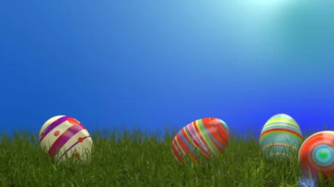 Easter eggs on the grass. Easter eggs slide down the slope covered with green ce Stock Footage 124319551