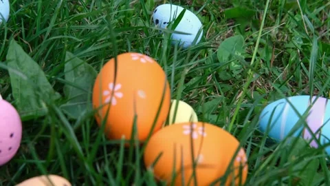 Easter eggs on the grass. Easter eggs slide down the slope covered Stock Footage 264996551