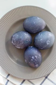 Easter eggs on a gray plate Stock Photos