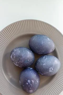 Easter eggs on a gray plate Stock Photos