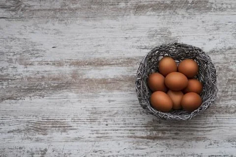 Easter eggs on a gray wooden background. Easter mockup with space for text. Stock Illustration