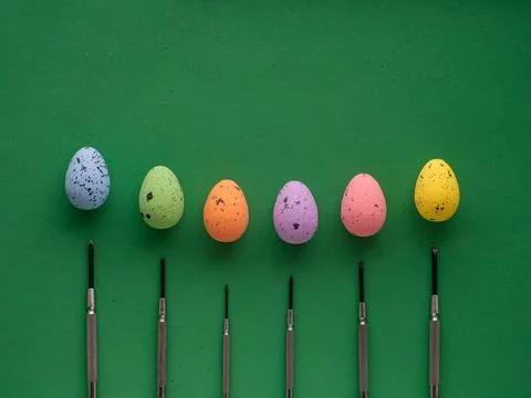 Easter eggs on green background with mini screwdrivers Stock Photos
