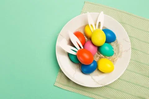 Easter eggs on green background, top view 库存照片