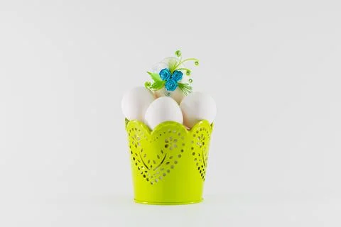 Easter eggs in a green basket Stock Photos