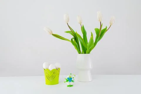 Easter eggs in a green basket Stock Photos