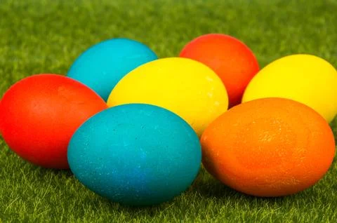 Easter eggs on green grass. Stock Photos