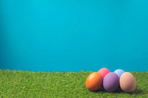 Easter eggs on the green grass. Stock Photos