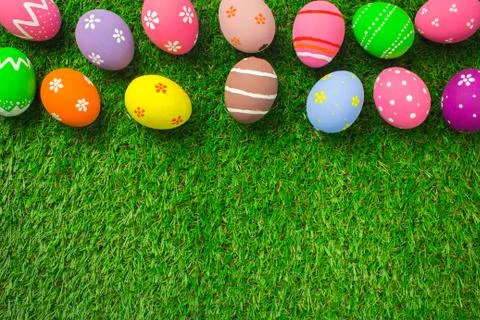 Easter eggs on the green grass. Stock Photos