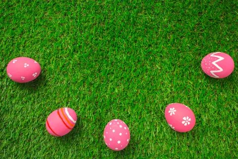 Easter eggs on the green grass. Stock Photos