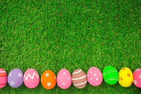 Easter eggs on the green grass. Stock Photos