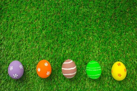 Easter eggs on the green grass. Stock Photos