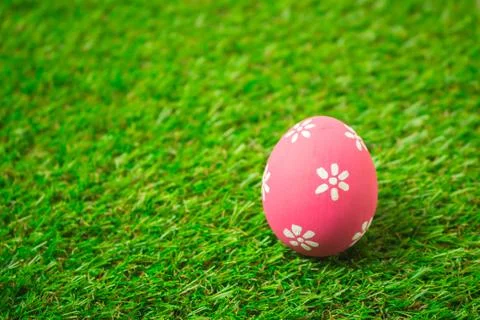 Easter eggs on the green grass. Stock Photos