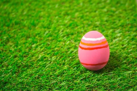 Easter eggs on the green grass. Stock Photos