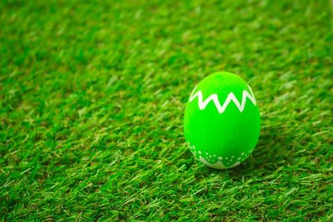 Easter eggs on the green grass. Stock Photos