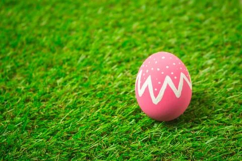 Easter eggs on the green grass. Stock Photos