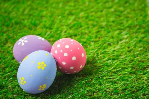 Easter eggs on the green grass. Stock Photos