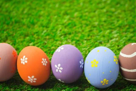 Easter eggs on the green grass. Stock Photos