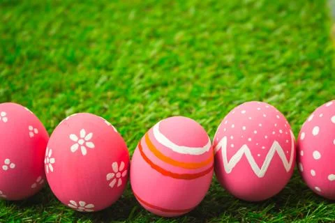 Easter eggs on the green grass. Stock Photos
