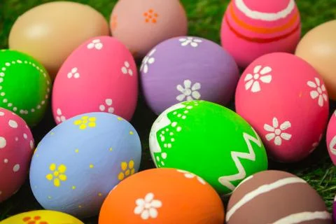 Easter eggs on the green grass. Stock Photos