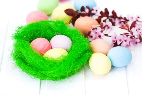 Easter eggs in green nest Stock Photos
