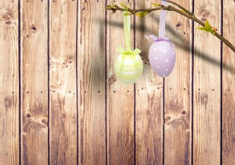 Easter eggs hanging in the garden. Stock Illustration