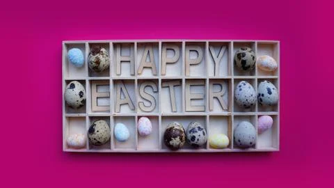 Easter eggs. Happy easter text. Holidays decoration pink background Stock Photos
