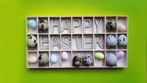 Easter eggs. Happy easter text. Holidays decoration green background Stock Photos