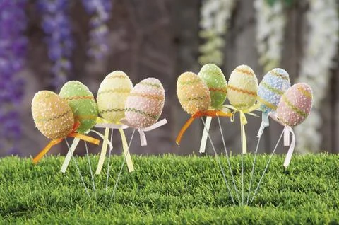 Easter eggs hidden in natural straw nest Stock Photos