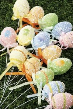 Easter eggs hidden in natural straw nest Stock Photos