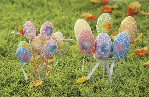 Easter eggs hidden in natural straw nest Stock Photos