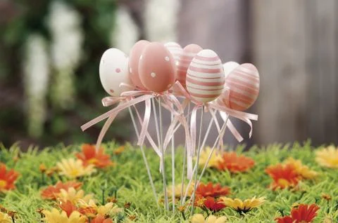 Easter eggs hidden in natural straw nest Stock Photos