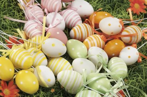 Easter eggs hidden in natural straw nest Stock Photos