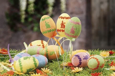 Easter eggs hidden in natural straw nest Stock Photos