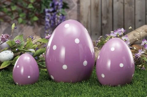 Easter eggs hidden in natural straw nest Stock Photos