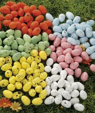 Easter eggs hidden in natural straw nest Stock Photos