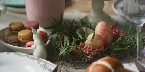 Easter eggs, hotcross buns and sweets on table dolly, yummy fun Stock Footage 106188531
