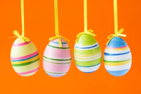 Easter eggs isolated on orange background Stock Photos