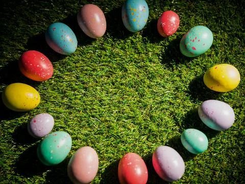 Easter eggs kept in circle on grass Stock Photos