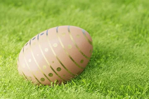 Easter eggs on a lawn in the grass. Brown Easter egg decorated with gilded pa Stock Illustration