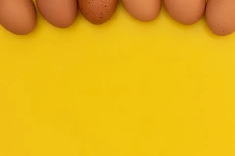 Easter eggs laying on the top on the yellow background Stock Photos
