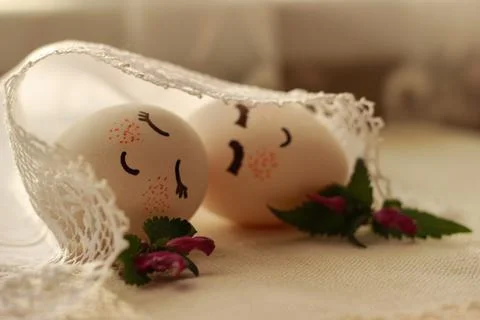 Easter eggs lie under a white napkin Stock Photos