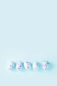 Easter eggs on the light blue background Stock Photos