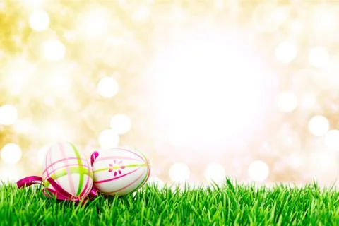 Easter eggs on meadow Stock Photos