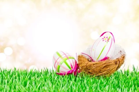 Easter eggs on meadow Stock Photos