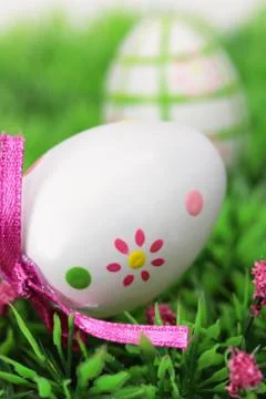 Easter eggs on meadow Stock Photos