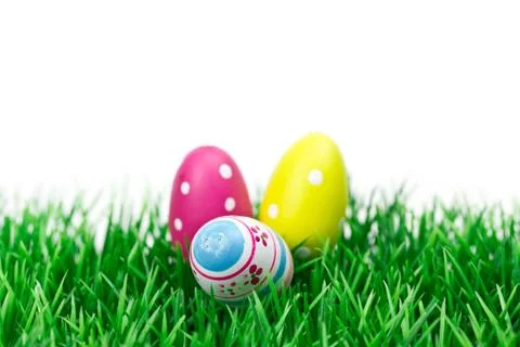 Easter eggs on meadow Stock Photos