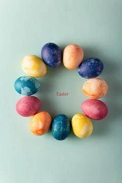 Easter eggs in minimal style on blue background. Easter concept. Flat layout, Stockfoto's