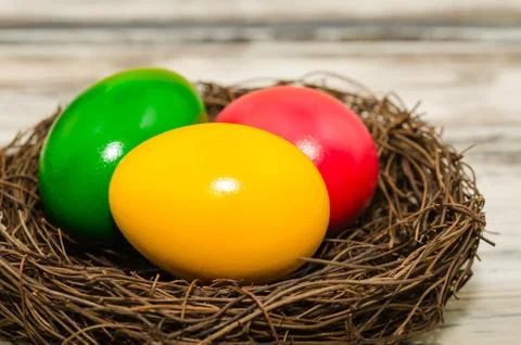 Easter eggs in a nest, close up view Stock Photos